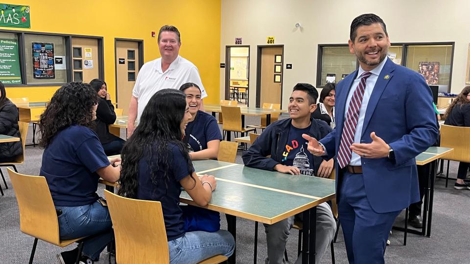 Representative Raúl Ruiz greets student leaders from Indio High School, jokingly referring to their presence on rival school grounds as "history making."