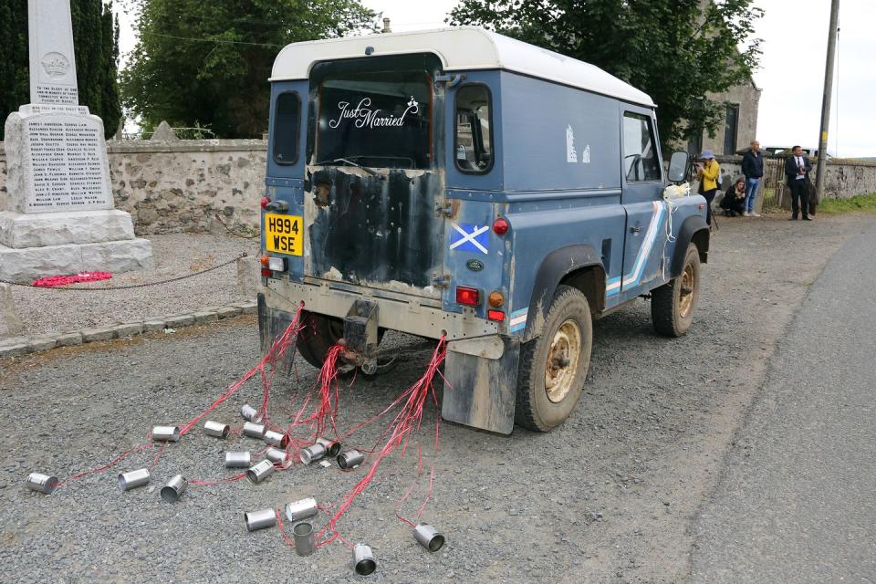 <p>The car featured a 'Just Married' sign and trailing cans.</p>