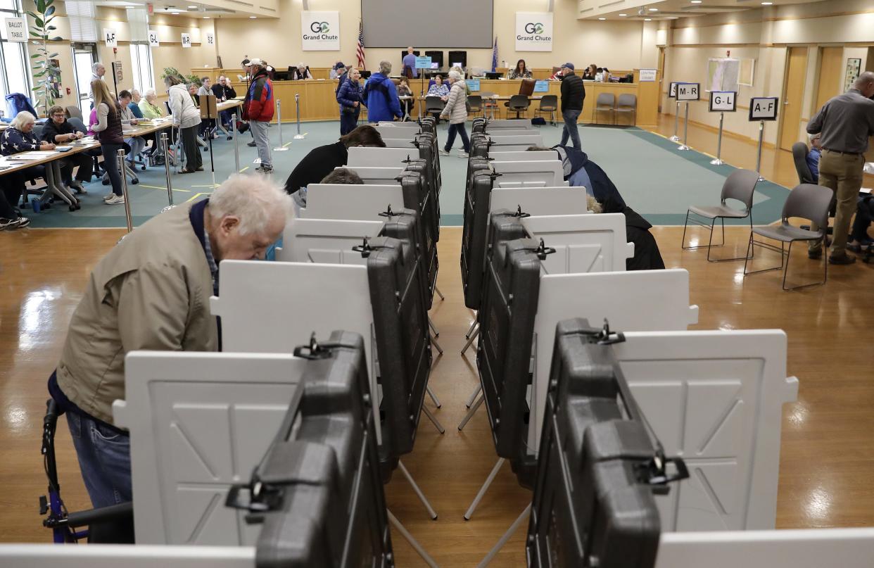 Residents vote Tuesday at the Grand Chute Town Hall.