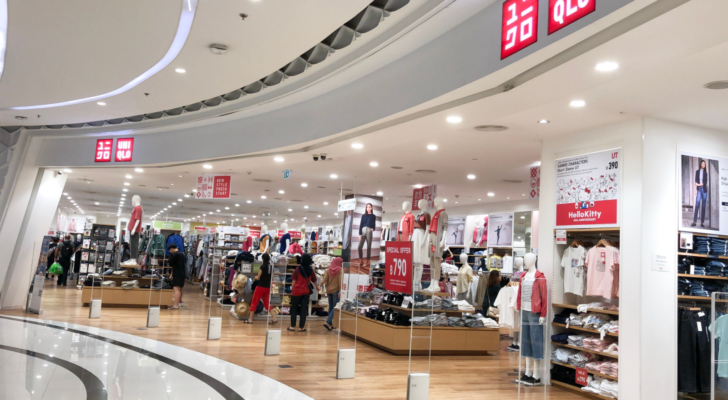 Entrance to Uniqlo store in the shopping mall in Thailand. Uniqlo is a successful global Japanese fast fashion retail brand.