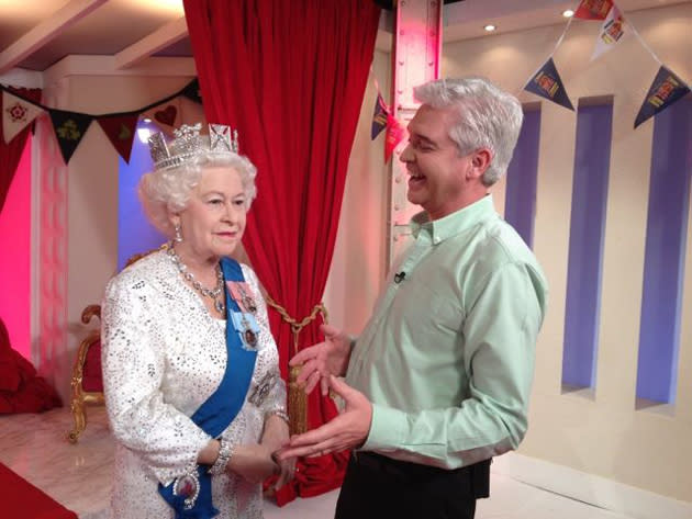 Celebrity photos: When a waxwork of the Queen arrived at the This Morning studios, Phillip Schofield couldn’t resist the opportunity to pose for a funny Twitpic. Phillip posted this photo with the caption: “It was a very proud moment to welcome The Queen to the studio. Here we are sharing a joke :)” [sic]