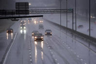 Drivers navigate slippery conditions caused by freezing rain along Interstate 40/85 near Burlington, N.C., Thursday, Feb. 18, 2021 as winter weather moves through the state. (AP Photo/Gerry Broome)