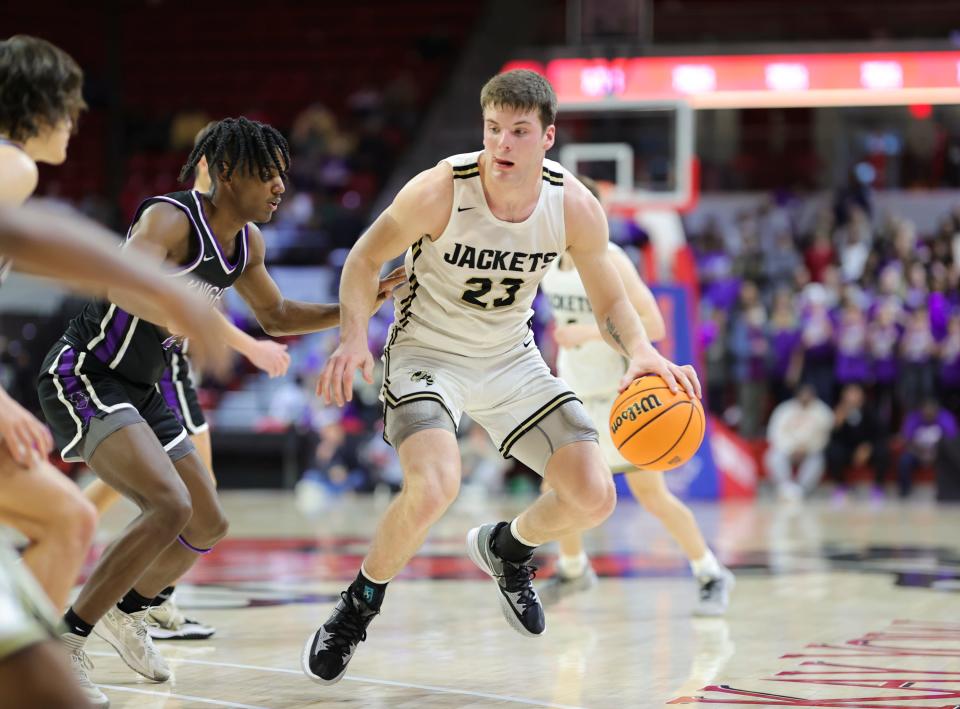 Jake McTaggart dribbles during Hayesville's state championship win.