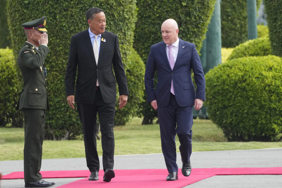 New Zealand's Prime Minister Christopher Luxon, right, is escorted by Thai Prime Minister Srettha Thavisin, before a welcoming ceremony at the Government House in Bangkok, Thailand, Wednesday, April 17, 2024. (AP Photo/Sakchai Lalit)