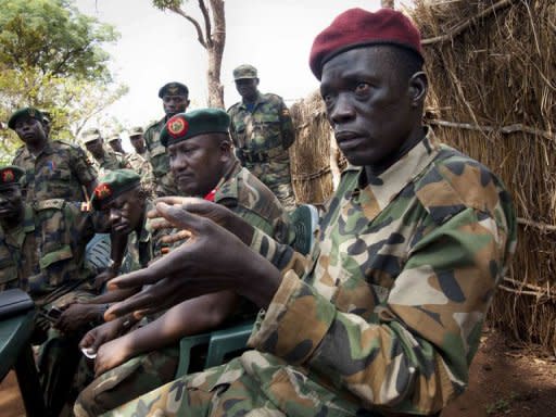 Ceasar Acellam, a senior member of the Lord's Resistance Army, (R) speaks to the press at the Ugandan army base in Djema. Ugandan troops have captured a senior member of the Lord's Resistance Army in a milestone arrest that could signal they are closing in on notorious rebel leader Joseph Kony