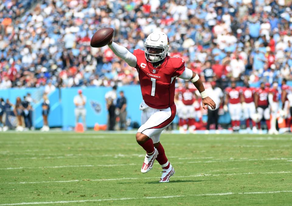 Arizona Cardinals quarterback Kyler Murray (1) celebrates as he runs in for a touchdown during the first half against the Tennessee Titans at Nissan Stadium.