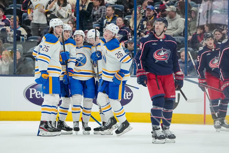 Dec 7, 2022; Columbus, Ohio, USA;  Columbus Blue Jackets defenseman Erik Gudbranson (44) watches the replay on the scoreboard as Buffalo Sabres celebrate a goal by defenseman Rasmus Dahlin (26) during the first period of the NHL hockey game at Nationwide Arena. Mandatory Credit: Adam Cairns-The Columbus Dispatch