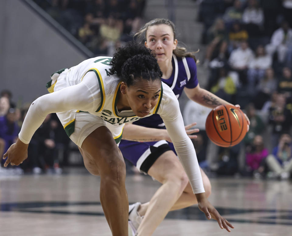 TCU guard Madison Conner, right, looks for a shot past Baylor guard Bella Fontleroy during the first half of an NCAA college basketball game Wednesday, Jan. 3, 2024, in Waco, Texas. (Rod Aydelotte/Waco Tribune-Herald via AP)
