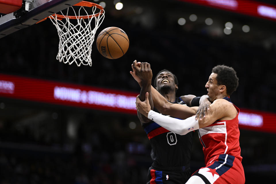 Washington Wizards forward Patrick Baldwin Jr., right, fouls Detroit Pistons center Jalen Duren (0) during the first half of an NBA basketball game Friday, March 29, 2024, in Washington. (AP Photo/Nick Wass)