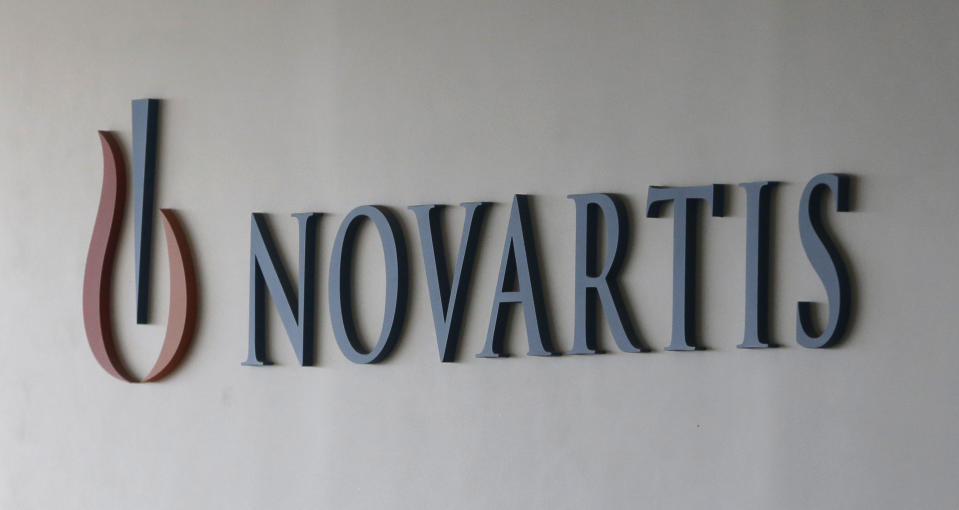 FILE - This Aug. 13, 2016, file photo shows a logo of Swiss pharmaceutical company Novartis in Seoul, South Korea. On Friday, May 24, 2019, U.S. regulators approved Zolgensma, the most expensive medicine ever, a therapy meant to cure a disorder that rapidly destroys a baby's muscle control and kills most within a couple years. (AP Photo/Ahn Young-joon, File)