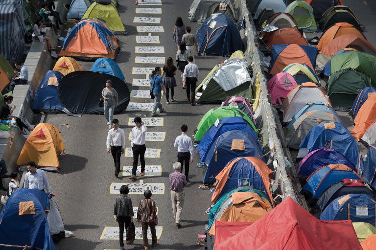 Pro-democracy protesters have held continuous street rallies in Hong Kong for a month, demanding free leadership elections for the semi-autonomous city in 2017