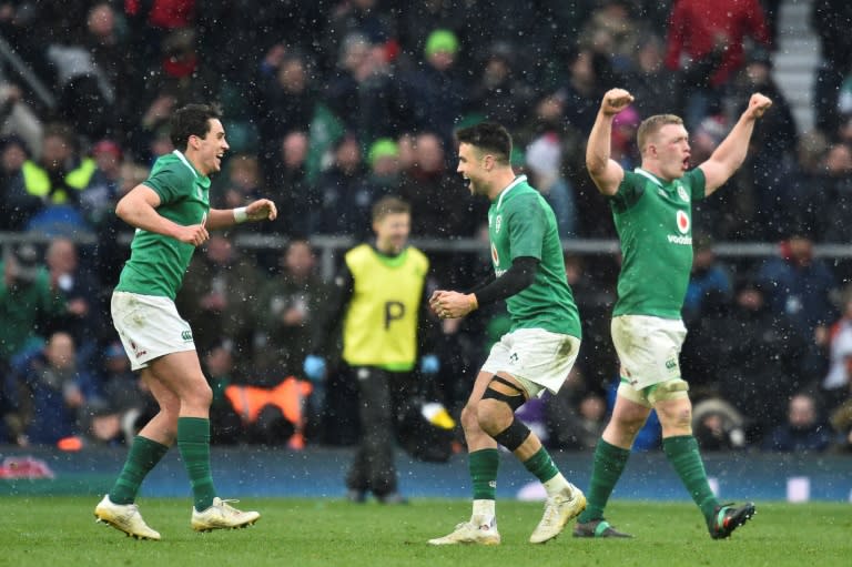 Ireland's Conor Murray (C) and Joey Carbery (L) celebrate their victory at the end of their Six Nations match against England at Twickenham