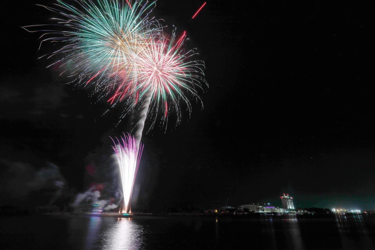 Fireworks illuminate the sky over the Savannah River during the annual Independence Day fireworks show.