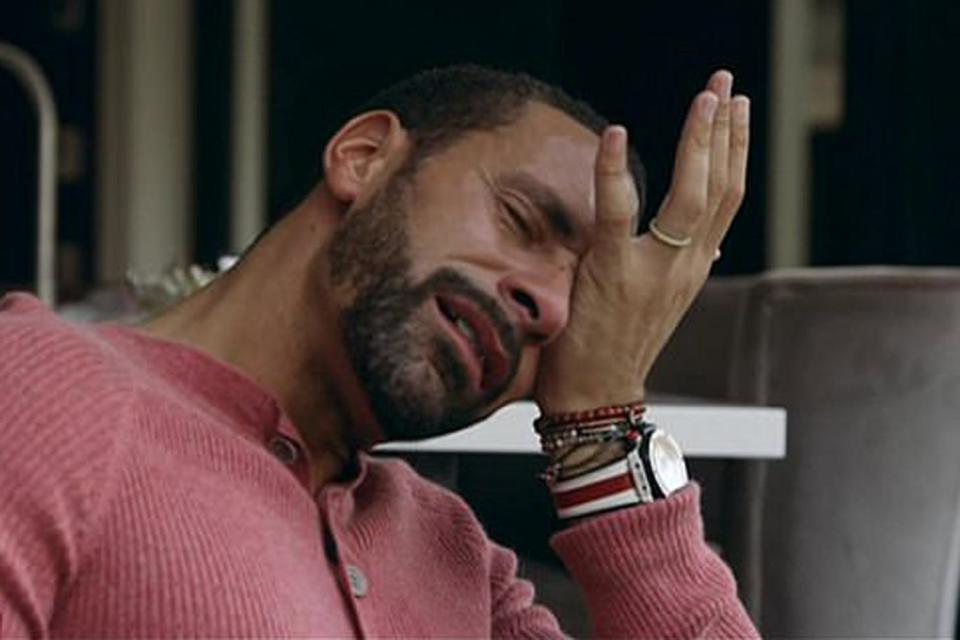 Rio Ferdinand wipes his eyes as he is filmed for BBC documentary Being Mum and Dad (BBC)