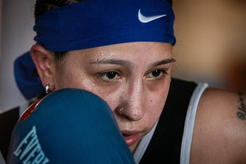 Jenelle Leal, 31, hits a bag at Gollihar Neighborhood Boxing Center on July 29, 2023, in Corpus Christi, Texas. After taking an eight year break from the sport, Leal's new goal is to become a professional boxer. "I need to fight," she said. "Coach Richard (Rodriguez), he's my first coach and I want him to be in my corner when I fight again."