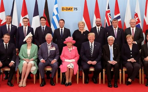 The Queen is flanked by Prince Charles and world leaders - Credit: Jack Hill