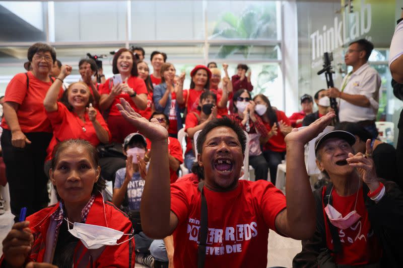 Pheu Thai supporters react during a parliamentary vote on Srettha Thavisin's PM bid, at the party headquarters, in Bangkok