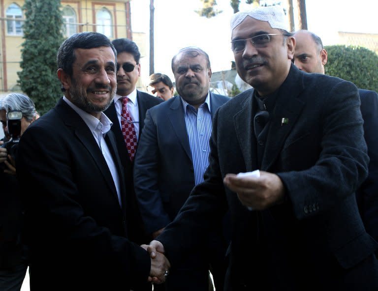 Iran's President Mahmoud Ahmadinejad (left) shakes hands with his Pakistani counterpart Asif Ali Zardari prior to talks in Tehran, on February 27, 2013. Iran's supreme leader Ayatollah Ali Khamenei on Wednesday told the visiting Pakistani president that a much-delayed $7.5 billion gas pipeline project must go ahead despite US opposition