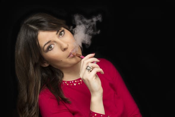 Electronic Cigarette,  looking at camera, black background