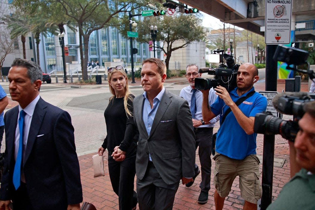 Ex-JEA CEO Aaron Zahn, leaves Federal Court with his wife, Mary Branan Ennis Zahn, after a federal grand jury indictment hearing Tuesday, March 8, 2022 in Jacksonville.