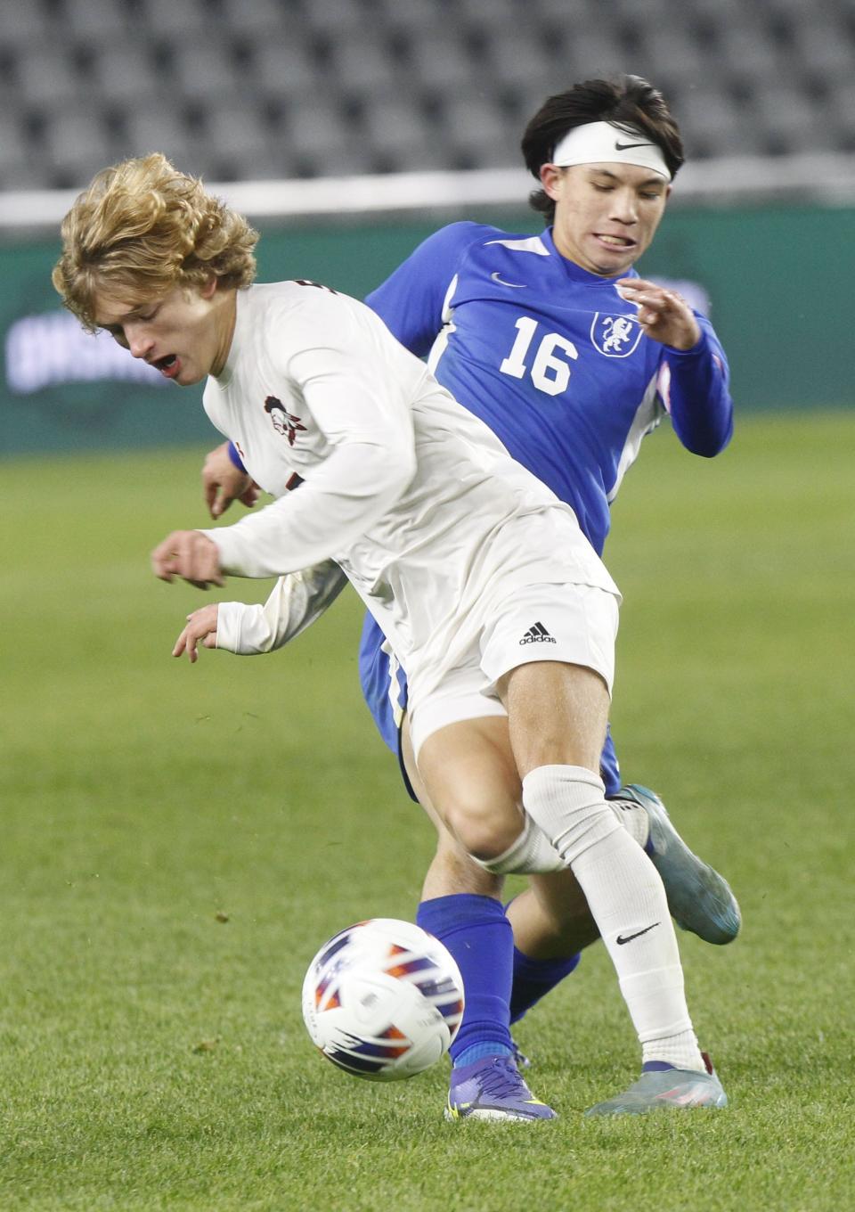 Lima Shawnee's Luca Fusillo and Bexley's Ethan Nguyen fight for the ball during the Division II State Soccer Championship game at Lower.com Field on Nov. 12. Bexley lost in a shootout. 