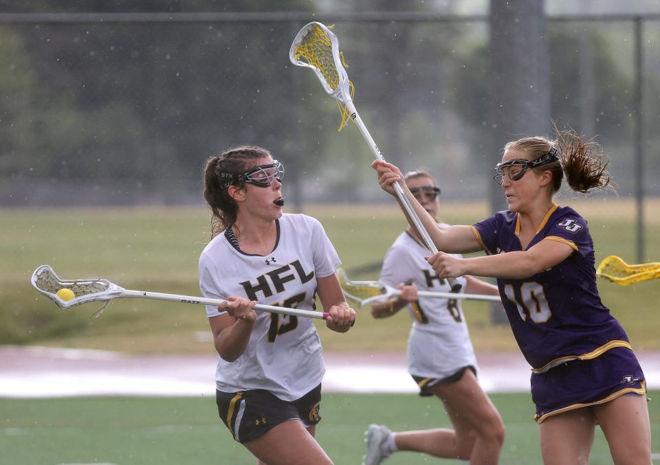 Honeoye Falls-Lima’s Paige Kidd looks to shoot around John Jay’s Finja Degl. 