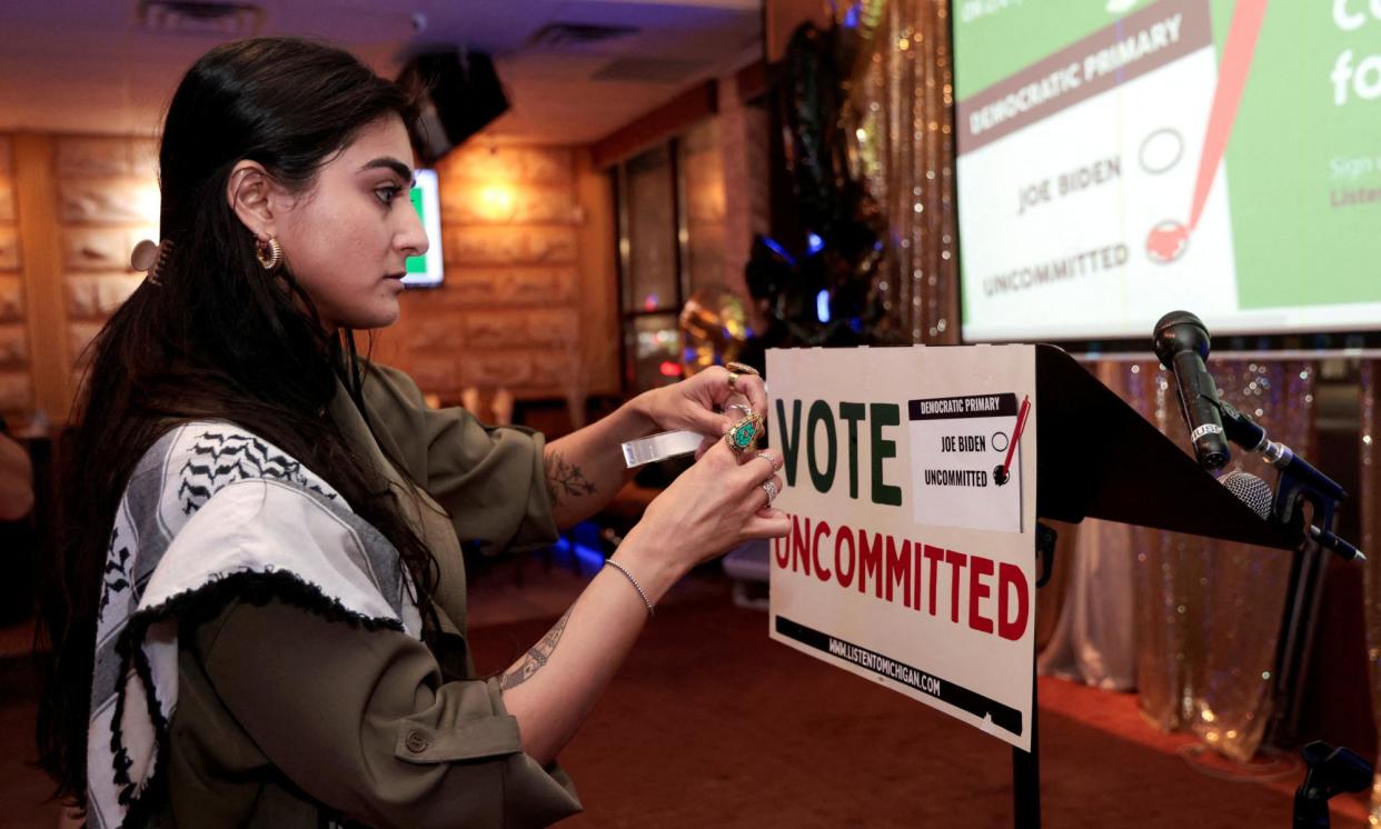 <span>An uncommitted voter at a primary election party in Michigan in February.</span><span>Photograph: Rebecca Cook/Reuters</span>