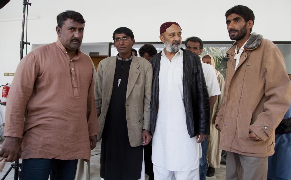 Released Pakistani fishermen arrived at the office of the International Committee of the Red Cross (ICRC) in Islamabad, Pakistan, Saturday, Feb. 11, 2017. Seven Pakistani fishermen who were jailed in Yemen for over a decade have returned home after efforts from the International Committee of the Red Cross and Pakistan's foreign affairs ministry. (AP Photo/B.K. Bangash)