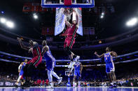 Miami Heat's Jaime Jaquez Jr., center, goes up for the dunk during the second half of an NBA basketball play-in tournament game against the Philadelphia 76ers, Wednesday, April 17, 2024, in Philadelphia. The 76ers won 105-104.(AP Photo/Chris Szagola)