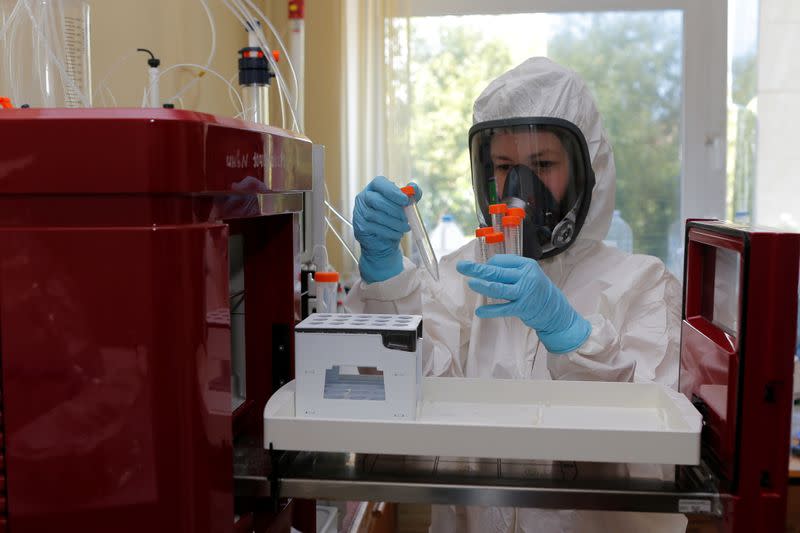 A scientist works inside a laboratory during the production and laboratory testing of a vaccine against the coronavirus disease in Moscow