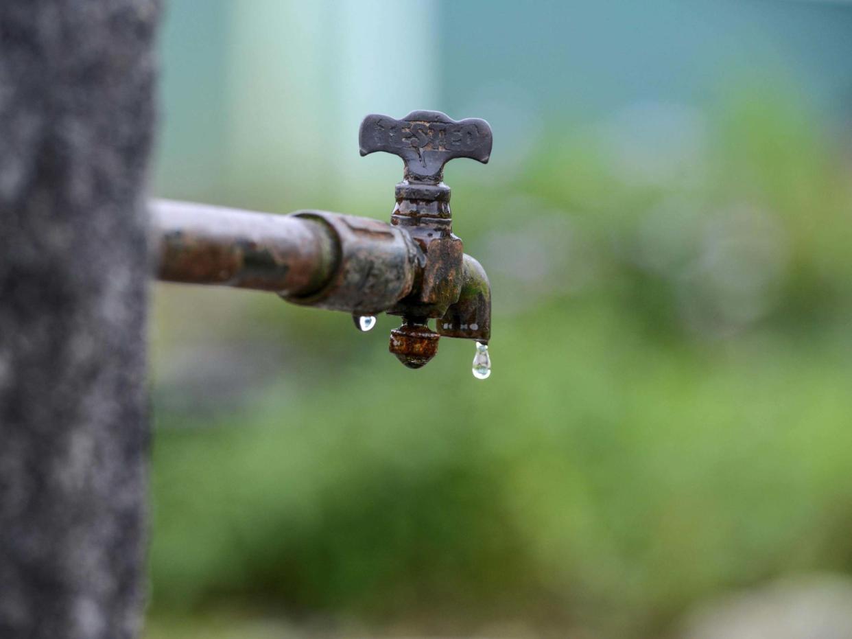 A stock image of a water faucet: AFP via Getty Images