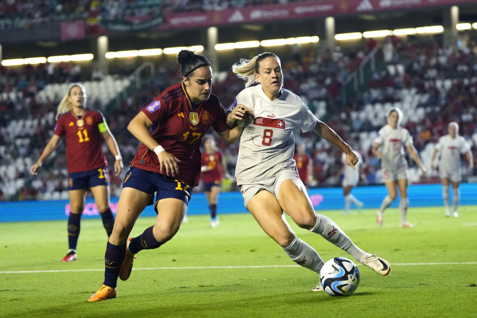 Switzerland's Nadine Riesen, right, and Spain's Lucía García fight for the ball during the women's Nations League group D soccer match between Spain and Switzerland at the Nuevo Arcangel stadium in Cordoba, Spain, Tuesday, Sept. 26, 2023. (AP Photo/Jose Breton)