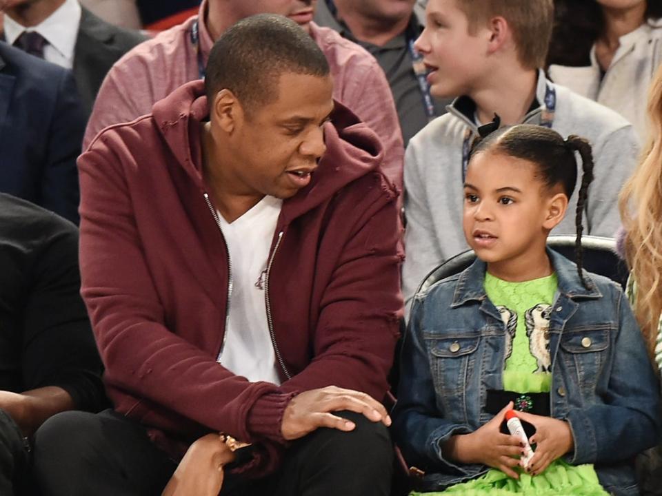 Jay Z and daughter Blue Ivy Carter attending the 66th NBA All-Star Game in 2001 (Getty Images)