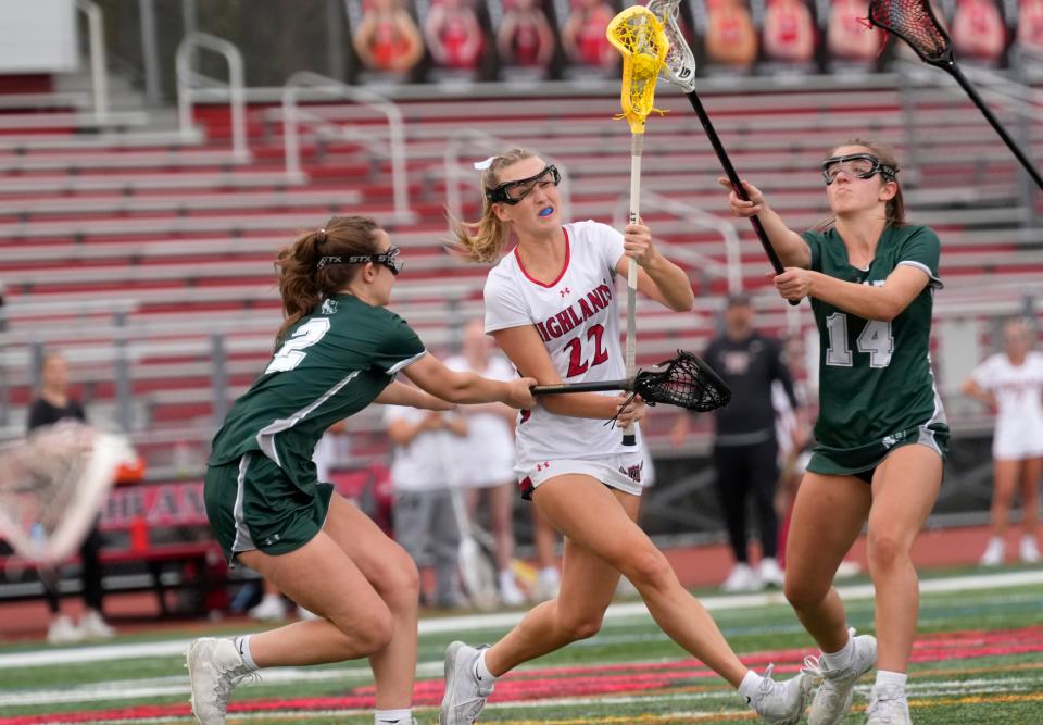 Maddie Willkomm, of Northern Highlands goes up against. Ava Ameres and Lara Palermo, of Ramapo. Tuesday, April 11, 2023 