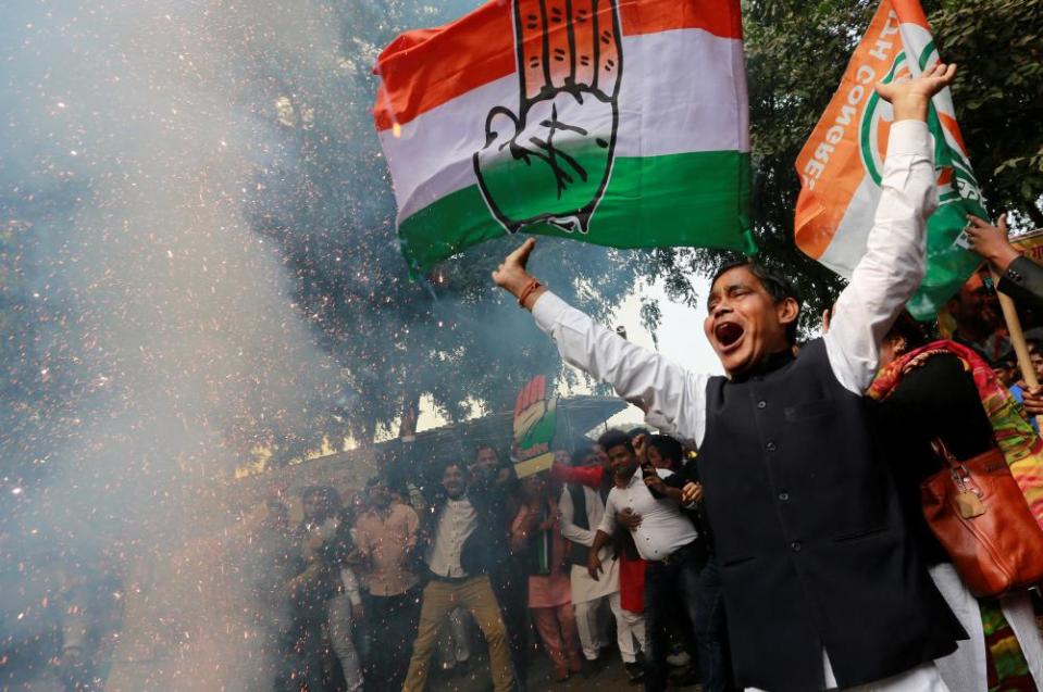 Supporters of India’s main opposition Congress party celebrate after initial poll results at the party headquarters in New Delhi, India, December 11, 2018. REUTERS/Adnan Abidi