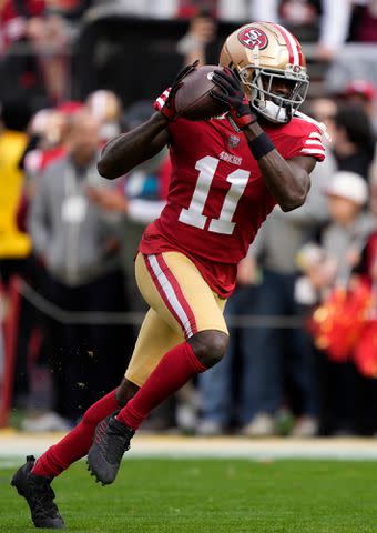 <p>Thearon W. Henderson/Getty</p> Brandon Aiyuk #11 of the San Francisco 49ers catches a pass during warm-ups prior to the game against the Arizona Cardinals January 08, 2023.