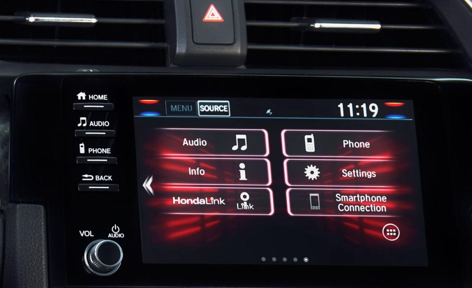 <p>When this generation Civic debuted, Honda took flack for its infotainment touchscreen, which relied on touch-sensitive slider controls to adjust volume instead of a good old-fashioned knob. It quickly set about trying to make things right, starting with going out of its way during the launch of <a href="https://www.caranddriver.com/honda/cr-v" rel="nofollow noopener" target="_blank" data-ylk="slk:the latest CR-V crossover;elm:context_link;itc:0;sec:content-canvas" class="link ">the latest CR-V crossover </a>to extoll that model’s new old-fangled knob, as if to say, “See?! There’s your damn knob!” That change has, as of 2019, finally hit the Civic lineup, including the Si. As before, steering-wheel volume controls are also standard, as is Apple CarPlay phone integration. </p>