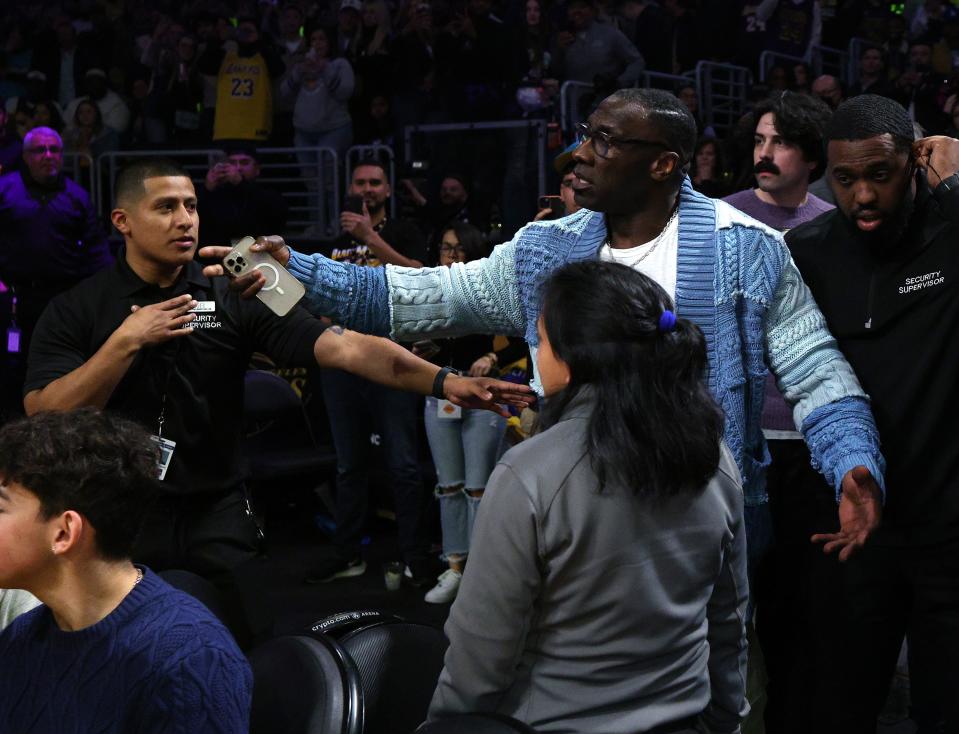 Pro Football Hall of Famer and 'Undisputed' talk show co-host Shannon Sharpe is retrained by security after a verbal altercation with Grizzlies star Ja Morant following the end of the first half against the Lakers at Crypto.com Arena in Los Angeles on Jan. 20, 2023 in Los Angeles.