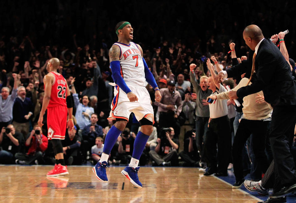 NEW YORK, NY - APRIL 08: Carmelo Anthony #7 of the New York Knicks celebrates shooting the game game tying three pointer in the fourth quarter as Taj Gibson #22 of the Chicago Bulls looks on at Madison Square Garden on April 8, 2012 in New York City. NOTE TO USER: User expressly acknowledges and agrees that, by downloading and/or using this Photograph, user is consenting to the terms and conditions of the Getty Images License Agreement. (Photo by Chris Trotman/Getty Images)