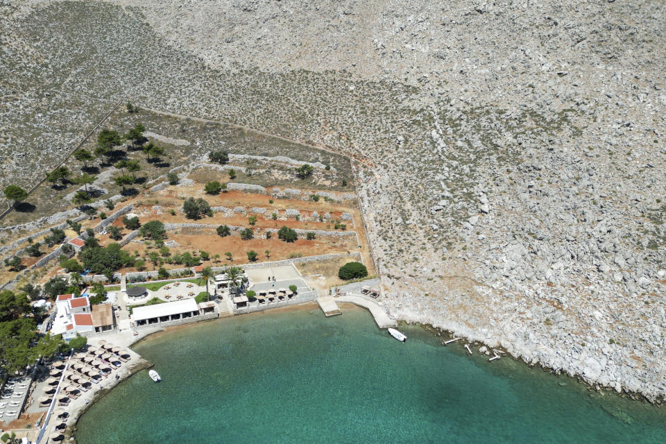 A general view of the area where the body of missing British TV presenter Michael Mosley was found, Sunday, June 9, 2024. The family of missing British TV presenter Dr. Michael Mosley have confirmed his body has been found on a Greek island. Mosley’s wife said Sunday in a statement that her husband had gone for a hike and took the wrong route and collapsed in a place where his body couldn’t easily be seen. (AP Photo/Panormitis Chatzigiannakis)