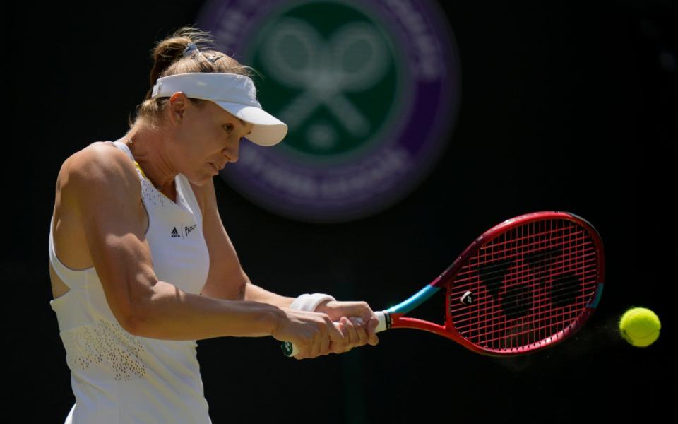 Kazakhstan's Elena Rybakina returns to Croatia's Petra Martic in a women's singles fourth round match on day eight of the Wimbledon tennis championships in London, Monday, July 4, 2022 - Alastair Grant/AP