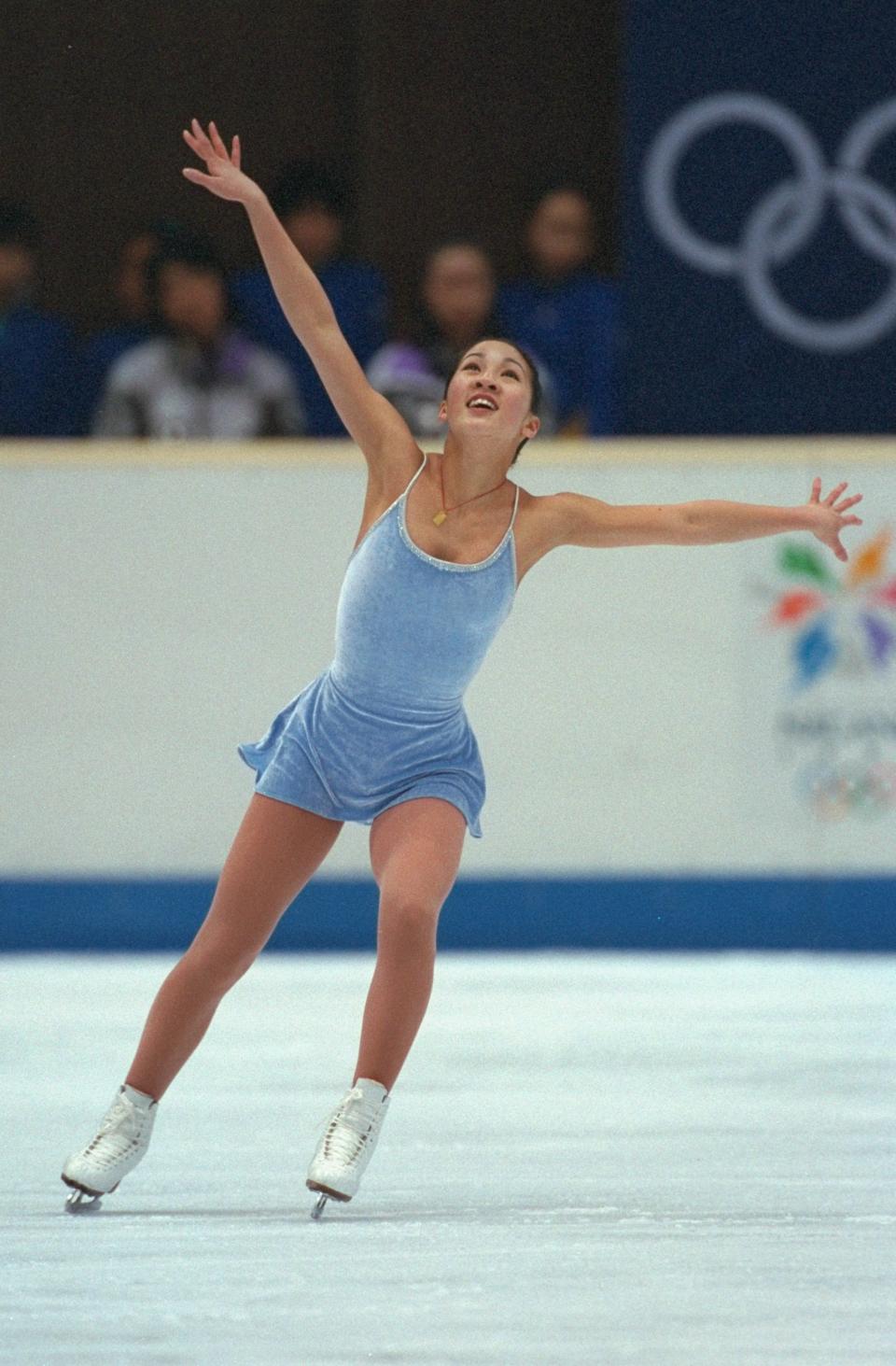 The American skater performing her routine during the free skate at White Ring Arena during the 1998 Winter Olympic Games in Nagano, Japan. Kwan won the silver medal.