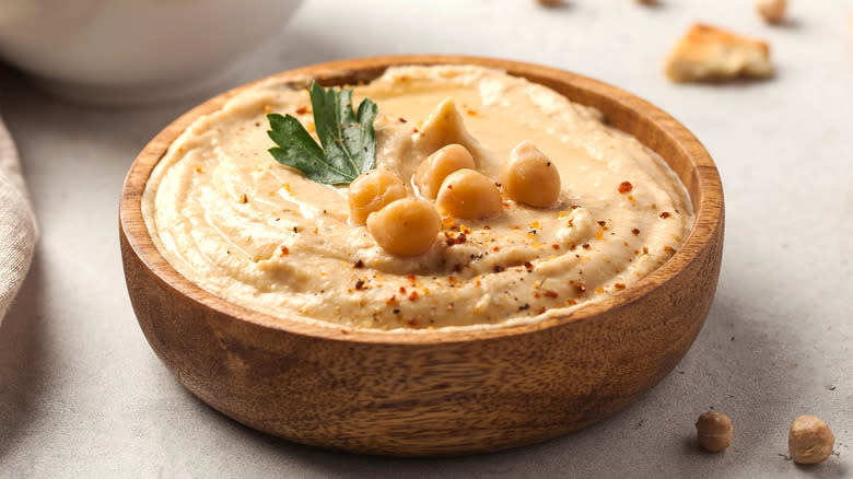 hummus in small wooden bowl