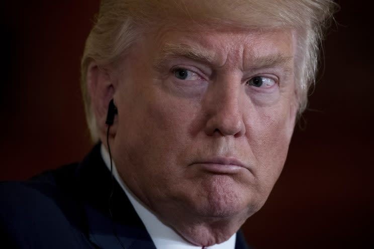 President Trump listens as Italian Prime Minister Paolo Gentiloni speaks during a news conference on Thursday