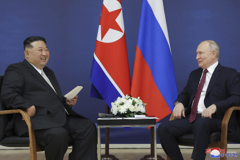 In this photo provided by the North Korean government, North Korean leader Kim Jong Un, left, and Russian President Vladimir Putin talk at the Vostochny cosmodrome outside the city of Tsiolkovsky, about 200 kilometers (125 miles) from the city of Blagoveshchensk in the far eastern Amur region, Russia, Wednesday, Sept. 13, 2023. Independent journalists were not given access to cover the event depicted in this image distributed by the North Korean government. The content of this image is as provided and cannot be independently verified. Korean language watermark on image as provided by source reads: "KCNA" which is the abbreviation for Korean Central News Agency. (Korean Central News Agency/Korea News Service via AP)