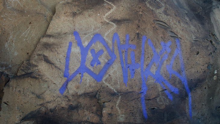 La Cieneguilla petroglyphs vandalized by spray paint