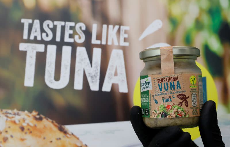 Staff holds a jar of Sensationnal Vuna at Nestle research center in Lausanne