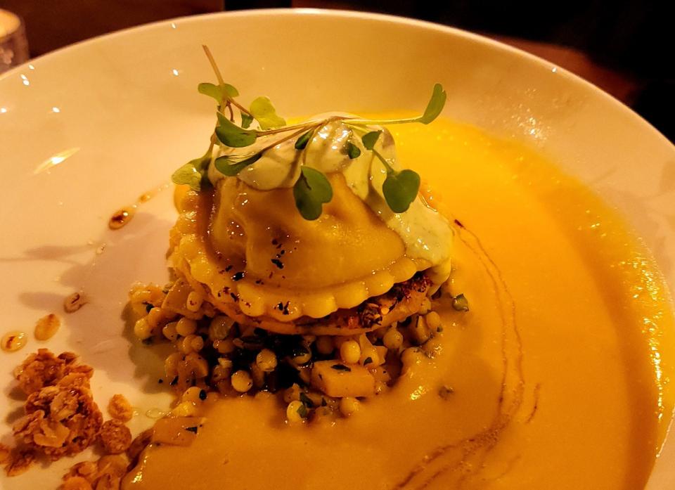 Rabbit Raviolo is a dish multi-layered with flavors and textures that included kabocha squash soup, tempura squash, cous cous and pine nut granola.