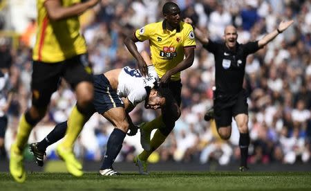 Britain Football Soccer - Tottenham Hotspur v Watford - Premier League - White Hart Lane - 8/4/17 Watford's Abdoulaye Doucoure in action with Tottenham's Mousa Dembele Reuters / Dylan Martinez Livepic