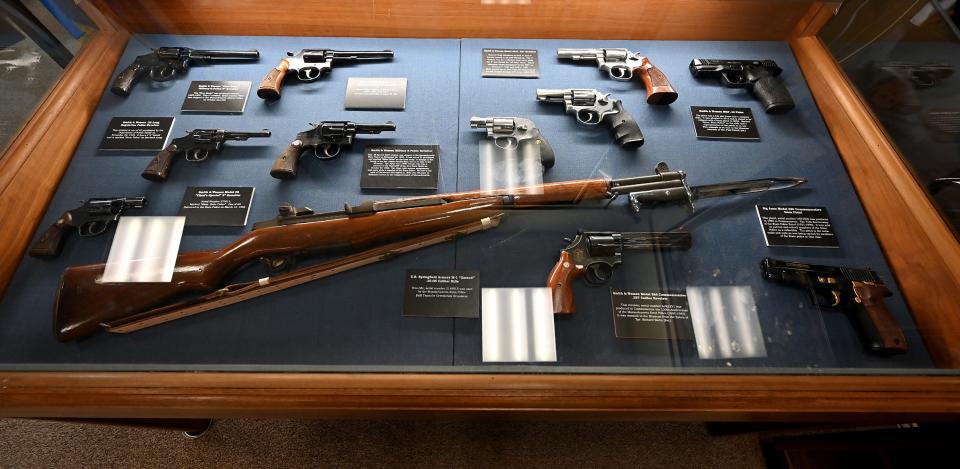 A display case of firearms at the Massachusetts State Police Museum and Learning Center.